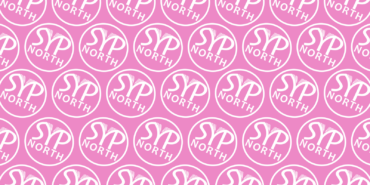 A pink background featuring a repeating pattern of the white SYP North roundel.
