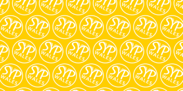 A yellow background featuring a repeating pattern of the white SYP Wales roundel.